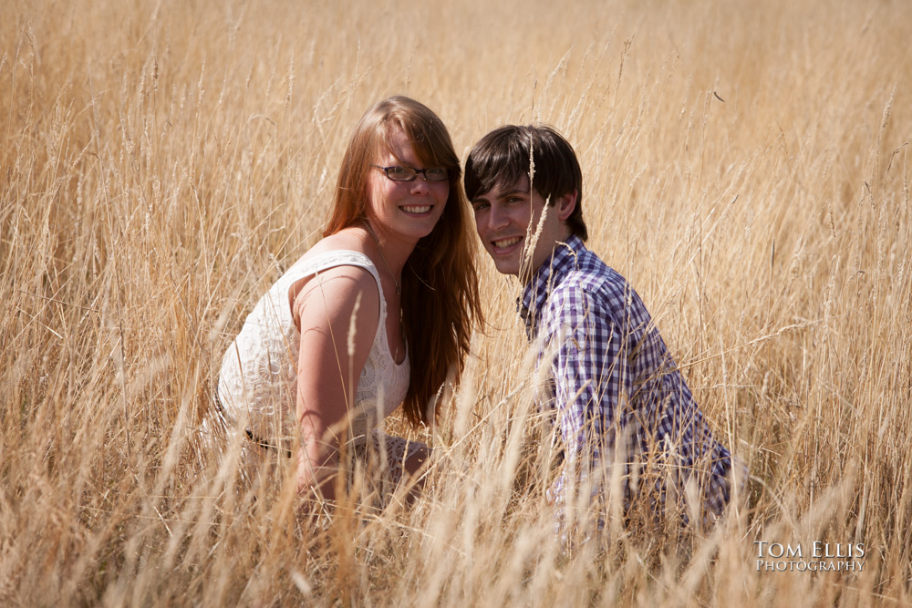 Engagement photo of couple in deep grass at Newcastle Golf Club