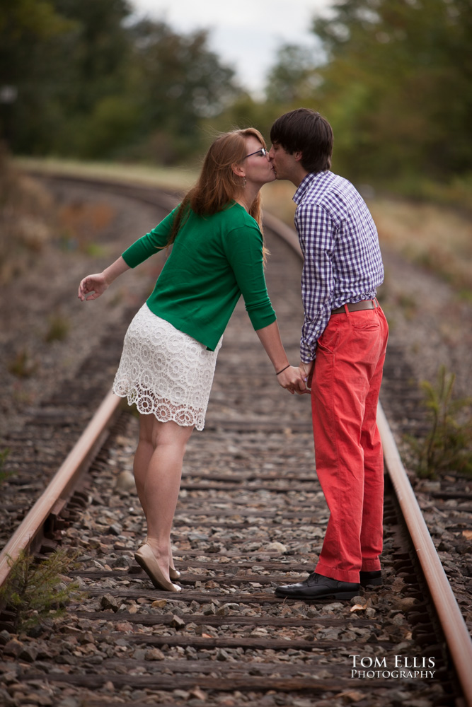 Trevor and Aurora kiss on the old train tracks near the Wilburton trestle in Bellevue