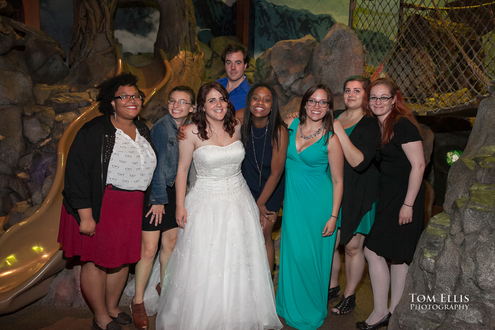 Bride and her work buddies pose for a photo during the reception