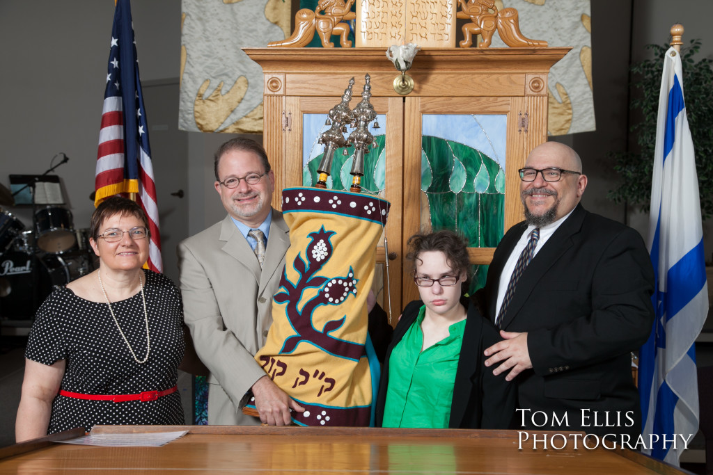 Becca and her parents pose with the Rabbi and the Torah at her Bat Mitzvah