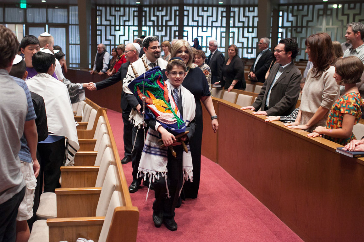 Eli and mother carrying the torah at Seattle Bar Mitzvah at Temple de Hirsh Sinai