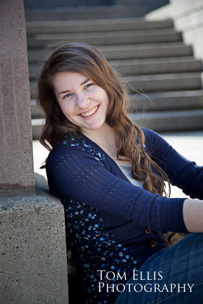 Senior girl sitting on concrete steps at Downtown Bellevue Park