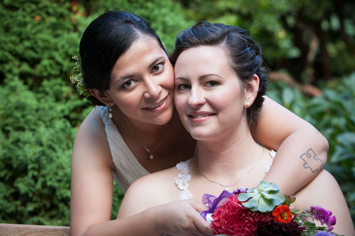Seattle wedding photographer Tom Ellis Photography. Close up shot of lesbian couple as they hug