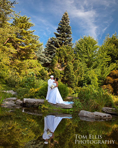 Couple reflected in pool at Kubota Garden in Seattle