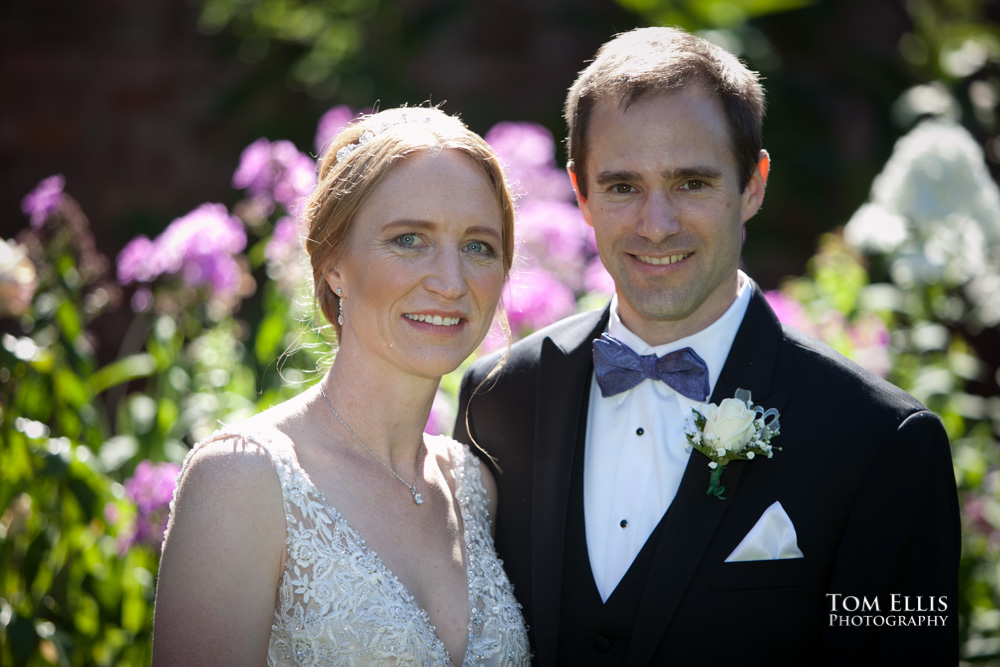 Rene and Dan pose for a photo in the formal garden at Thornewood Castle