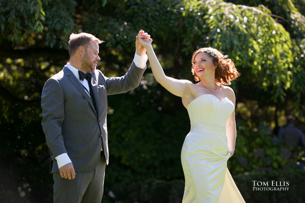 Shiela and Timothy share a quick dance before their Seattle wedding at Parson's Garden