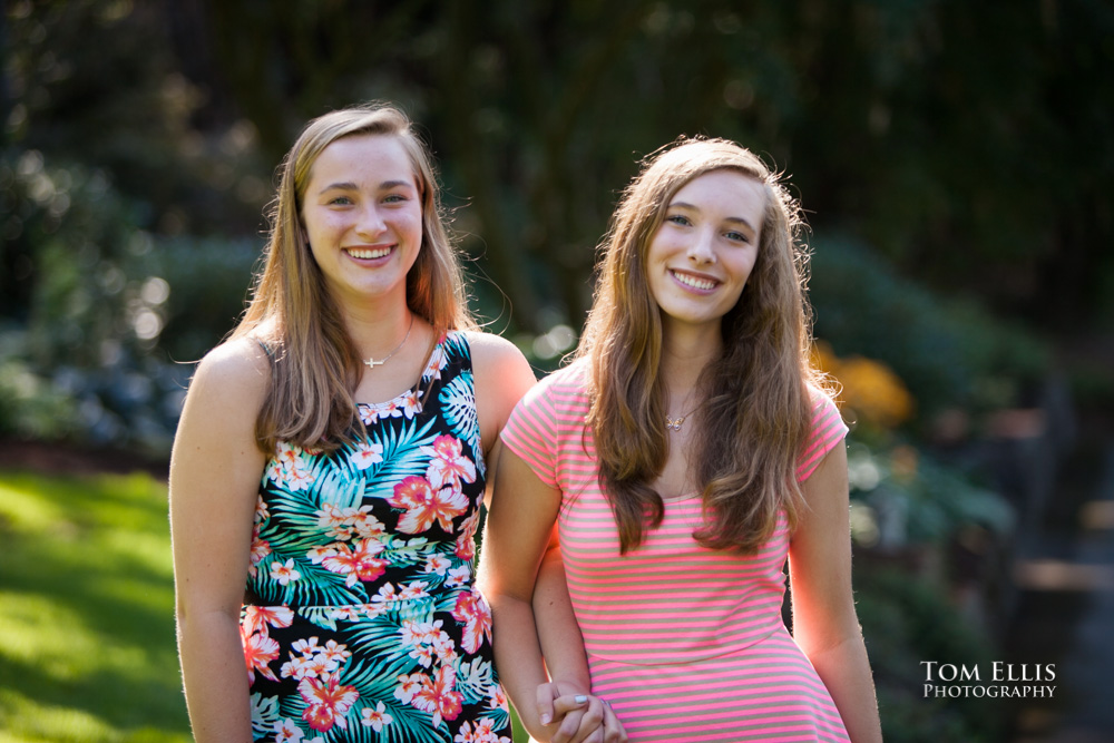 The Morris twins pose for a photo during their Seattle area senior photo session at Chism Beach Park