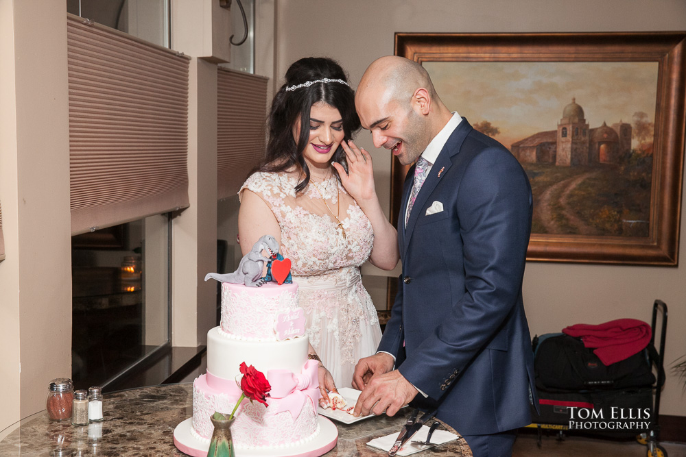 Ahlam and Khalid cut their engagement cake during their Seattle area engagement party