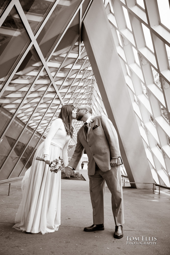 Julia and Matt during their pre-ceremony photo session outside the Seattle Library before their elopement wedding at the Seattle Municipal Courthouse. Tom Ellis Photography, Seattle elopement and courthouse wedding photographer