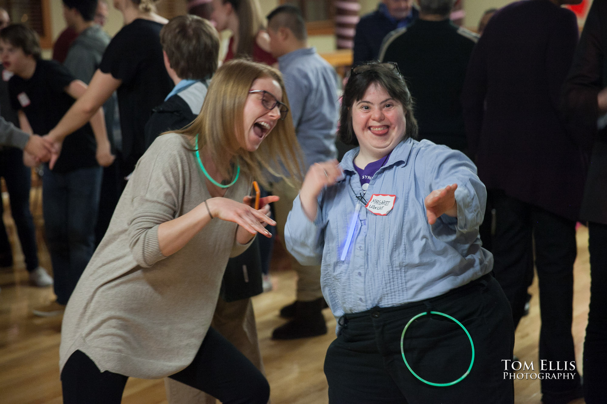 Two girls dancing at the 2016 Down Syndrome Community Sweetheart Dance