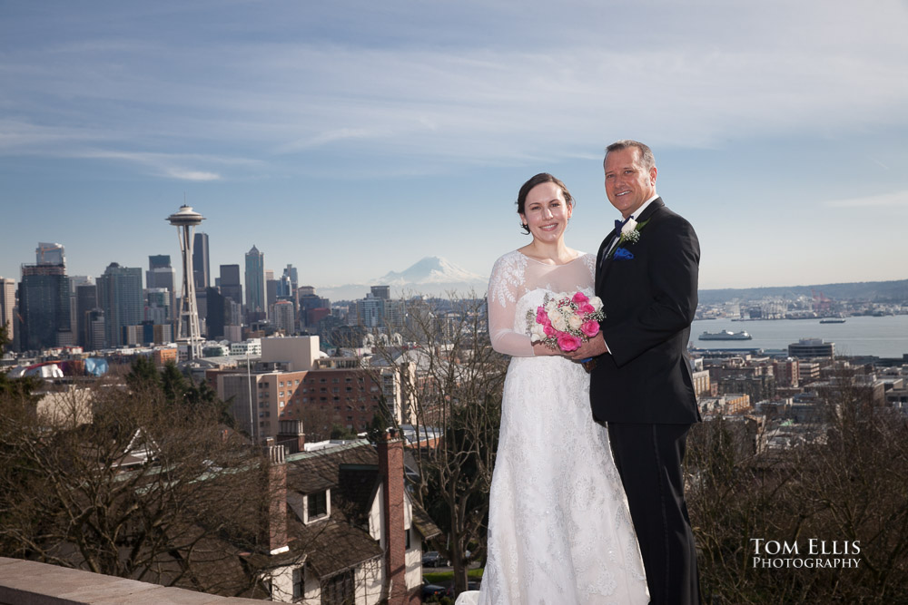 Bride and groom at Kerry Park in Seattle, with the Seattle Center, Space Needle and Mt Rainier in the background