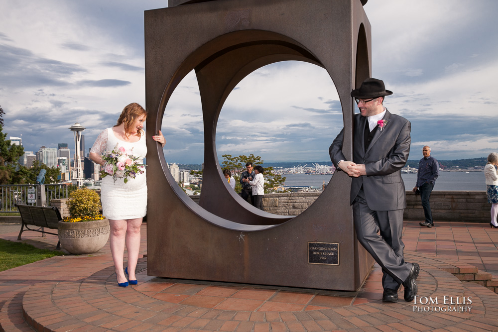 Newlywed couple pose for a photo at Kerry Park after their elopement wedding ceremony at the Seattle Municipal Courthouse