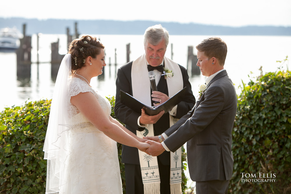 Julika and Jess giving their wedding vows at their same-sex wedding ceremony at Ballard Bay Club in Seattle