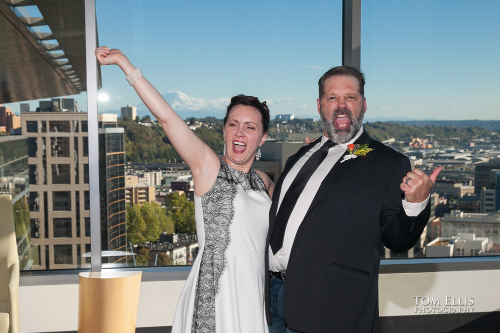 Bride and groom celebrate after the completion of their wedding ceremony at the Seattle Municipal Courthouse