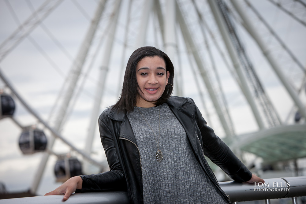 Aleisha poses for a photo in front of the Great Wheel at the Seattle Waterfront during her senior photography session