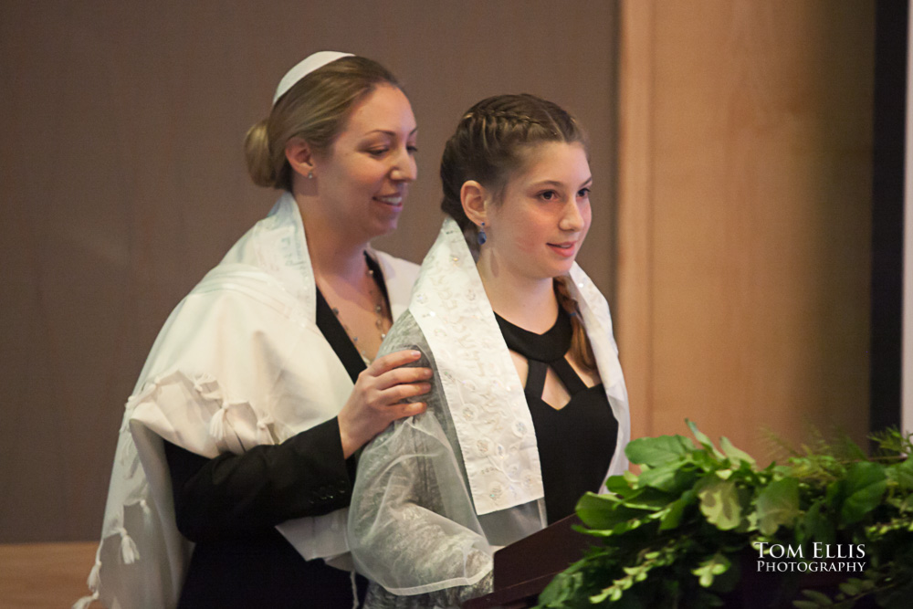 Young girl with her rabbi as they begin her Bat Mitzvah ceremony in Seattle