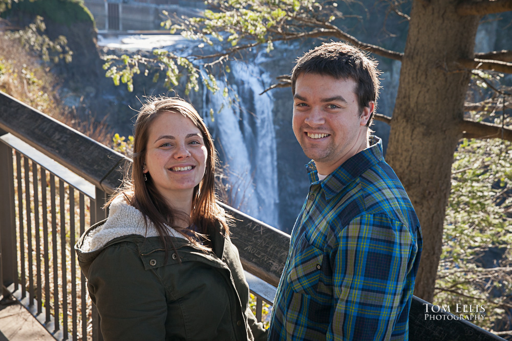 Engagement photo of couple with Snoqualmie Falls in the background