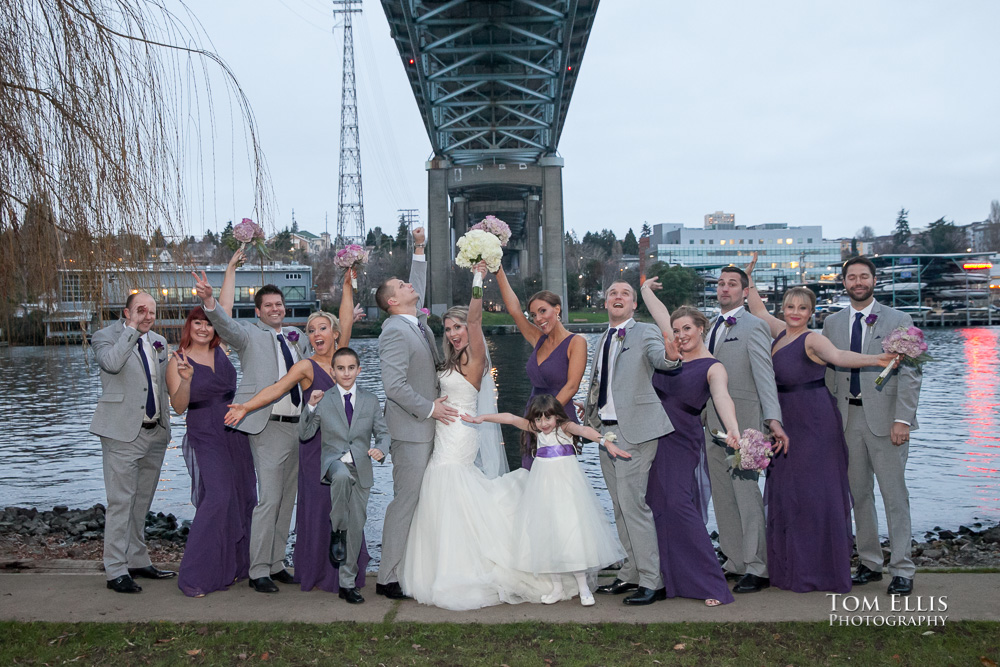 Wedding party posed near the ship canal at their Seattle wedding at the Lake Union Cafe