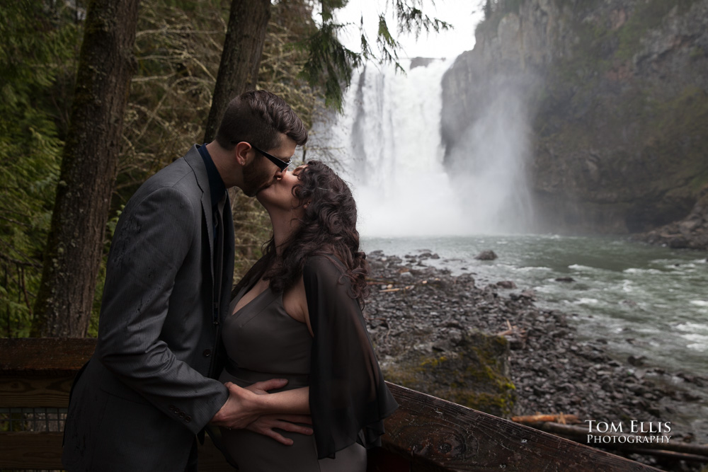 Bride and gromm kiss at the conclusion of their elopement wedding ceremony at Snoqualmie Falls. Tom Ellis Photography, destination wedding photographer