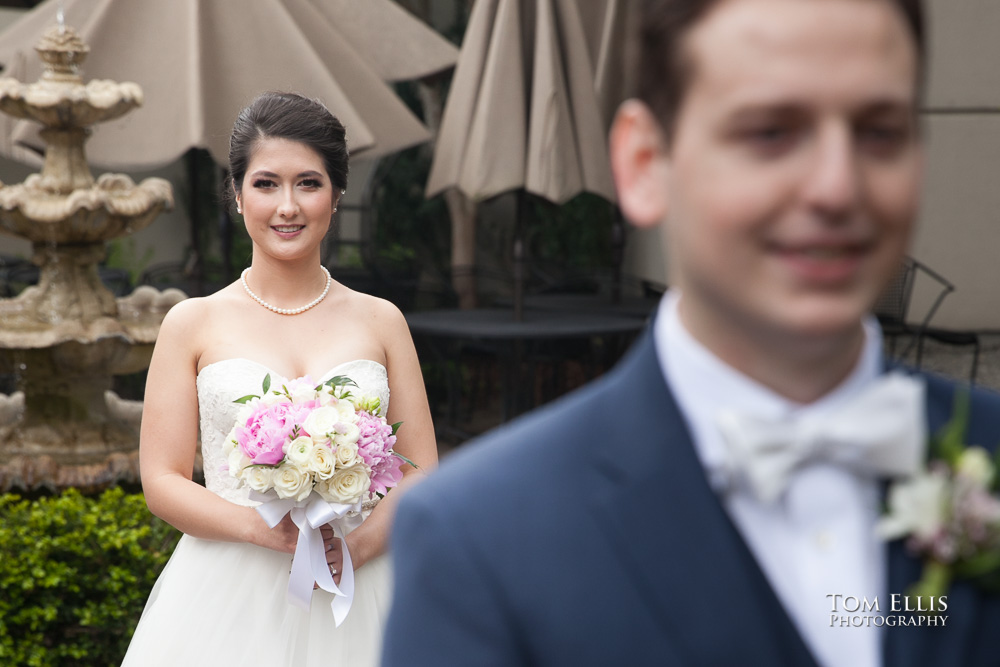 Bride approaches the groom from behind for their "first look" on their wedding day