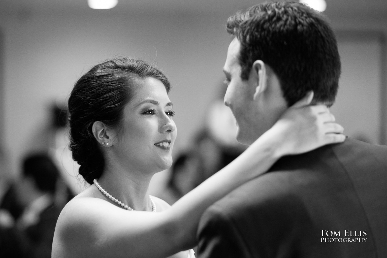 Black and white photo of bride and groom's first dance as a newly married couple