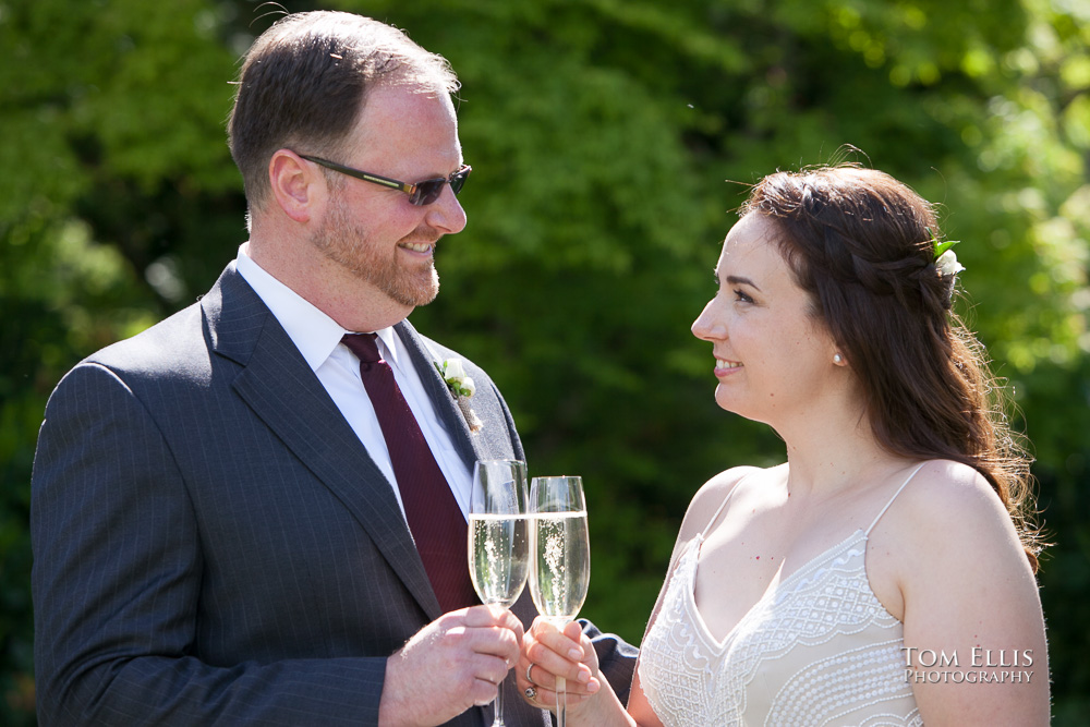 Willows Lodge elopement wedding, bride and groom toast with champagne