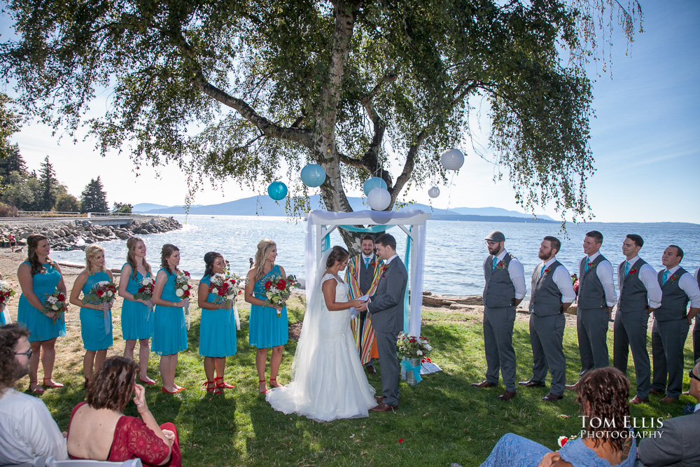 Outdoor wedding ceremony held on the beach at Bellingham's Marine Park, photographed by Tom Ellis Photography