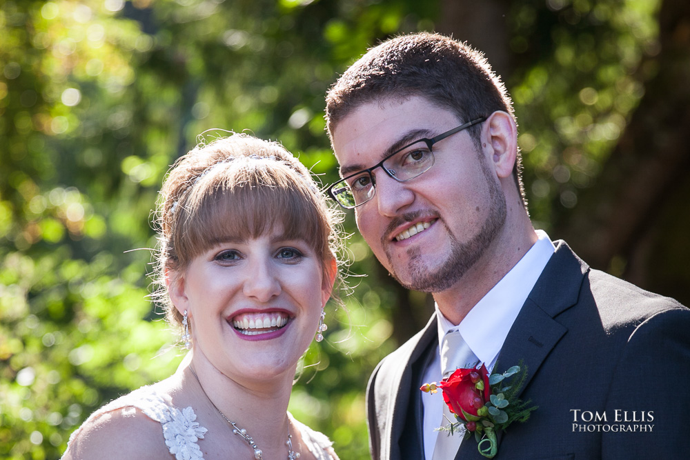 Close up beautifully backlit photo of bride and groom before their Seattle area wedding at French Creek Manor, photographed by Seattle wedding photographer Tom Ellis Photography