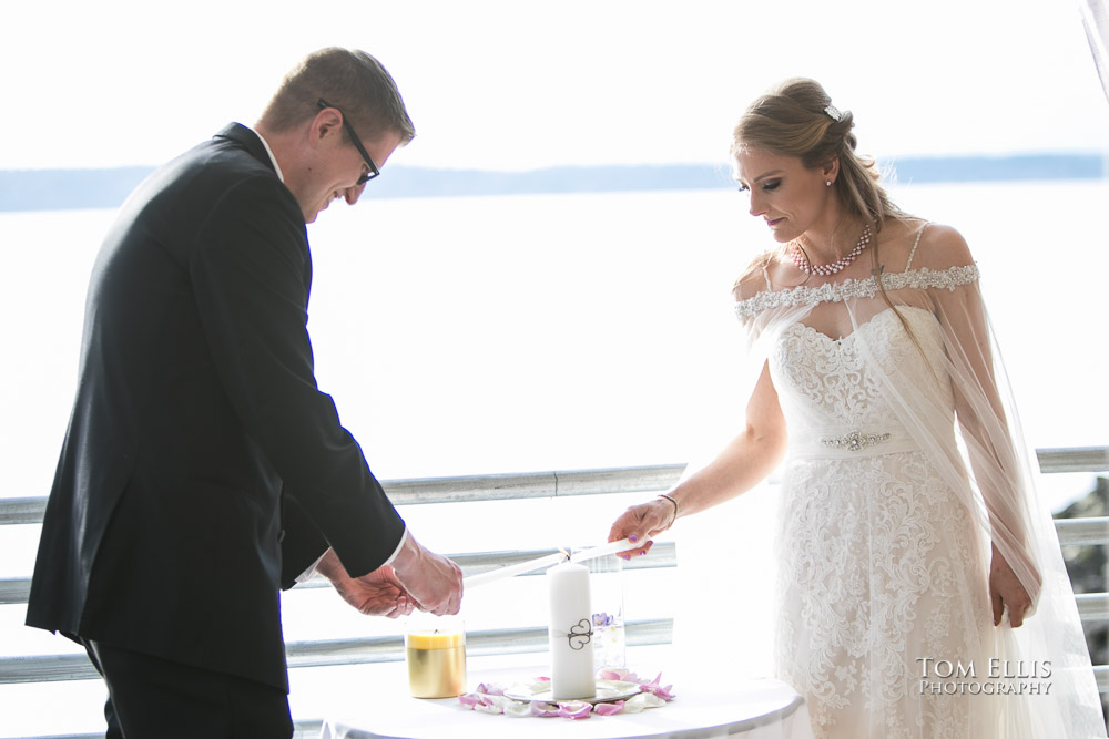 Bride and groom light their Unity candle at their Seattle area wedding at Ray's Boathouse