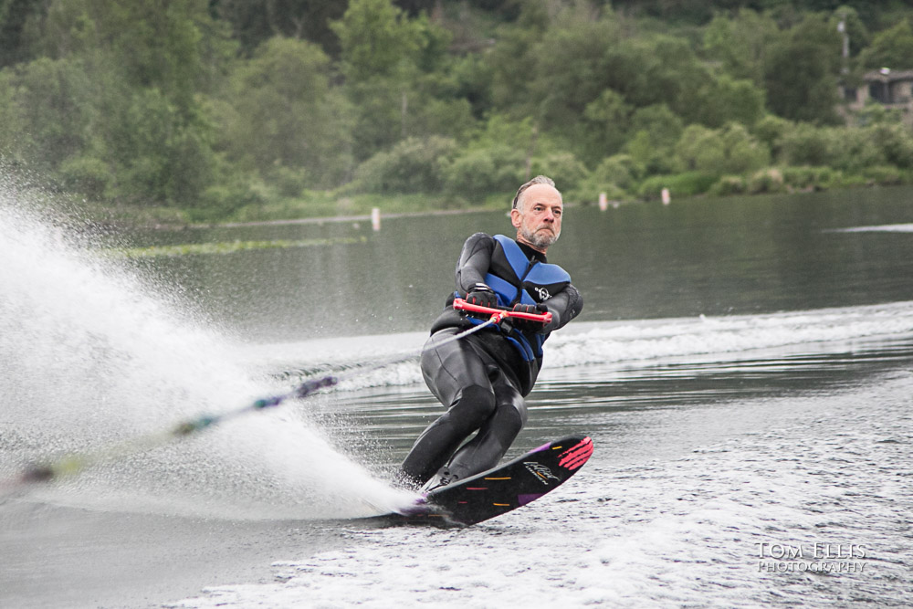 Steve cuts hard toward the wake whjile waterskiing on Lake Sammamish