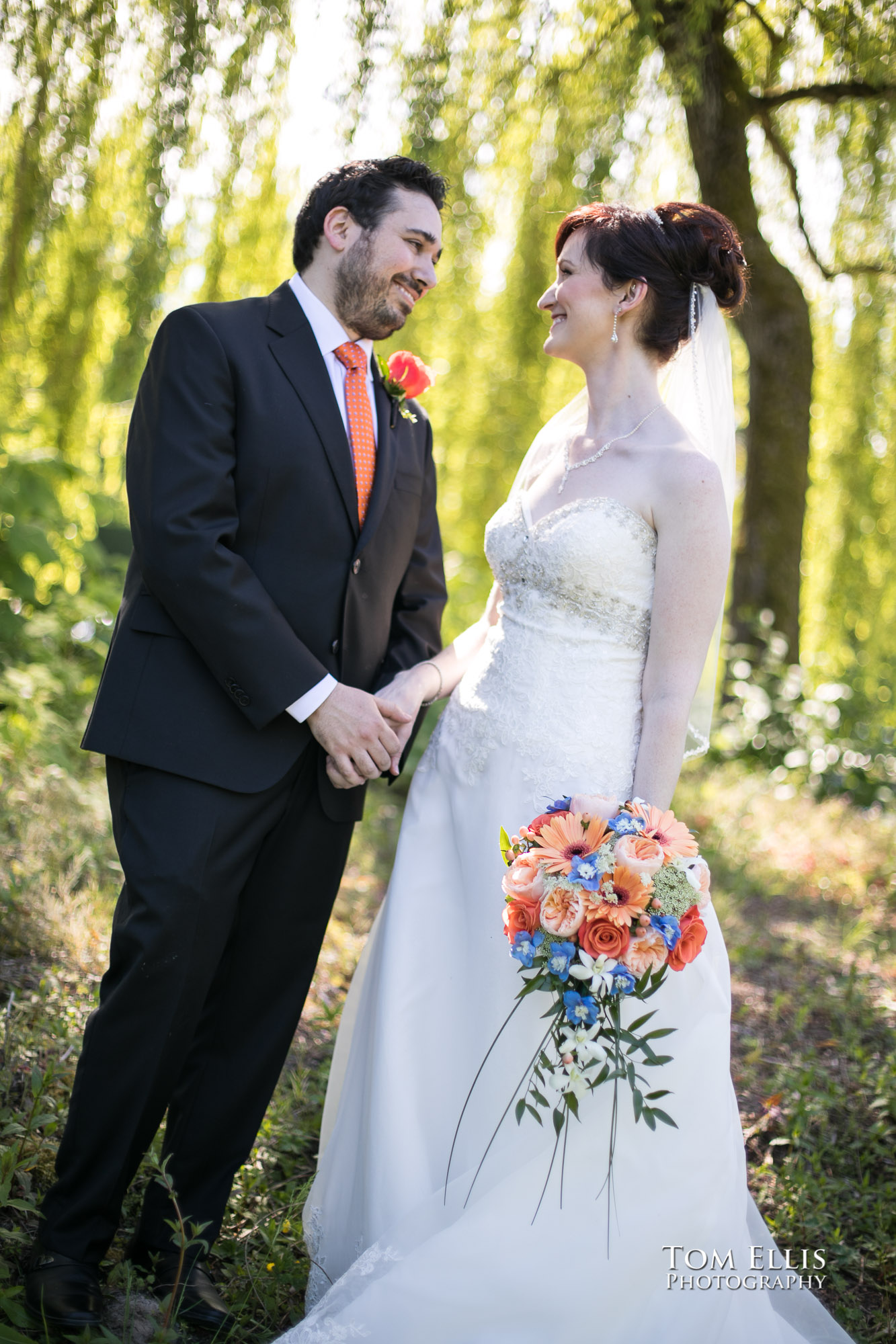 Bride and groom together in the woods before their wedding ceremony at Willows Lodge