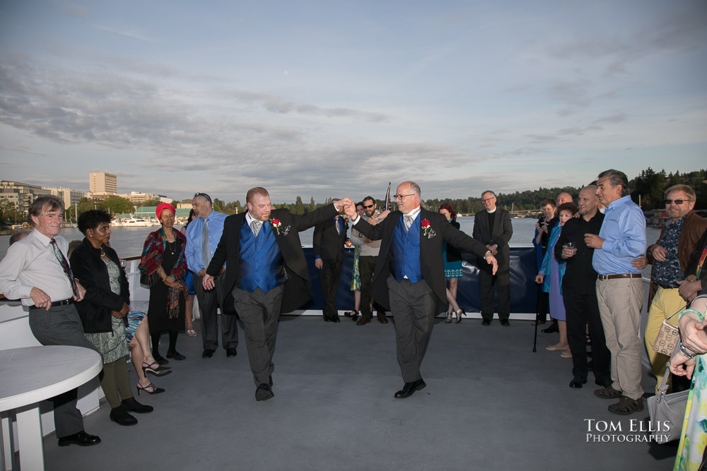 Jeff and Jéaux share their first dance as a married couple during their same-sex wedding reception on the Emerald Star cruise ship. 