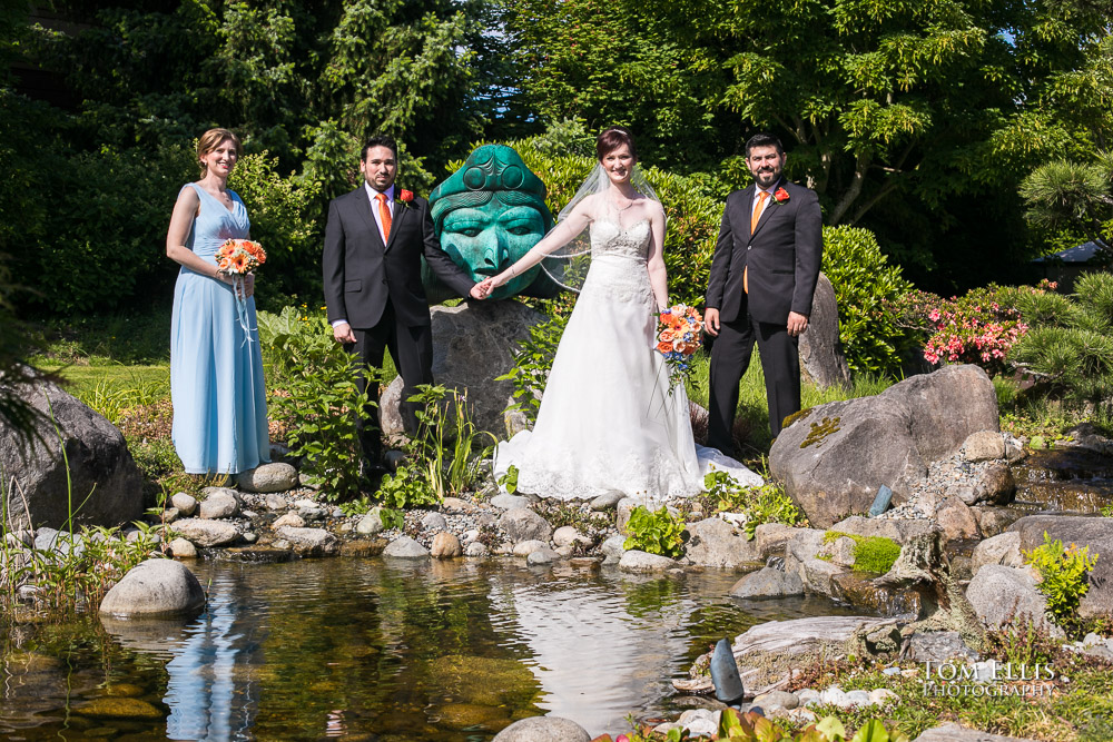 David and Angie pose near a gorgeous pond with their best man and maid of honor before their wedding ceremony at Willows Lodge. Tom Ellis Photography, Seattle's premier wedding photographer.