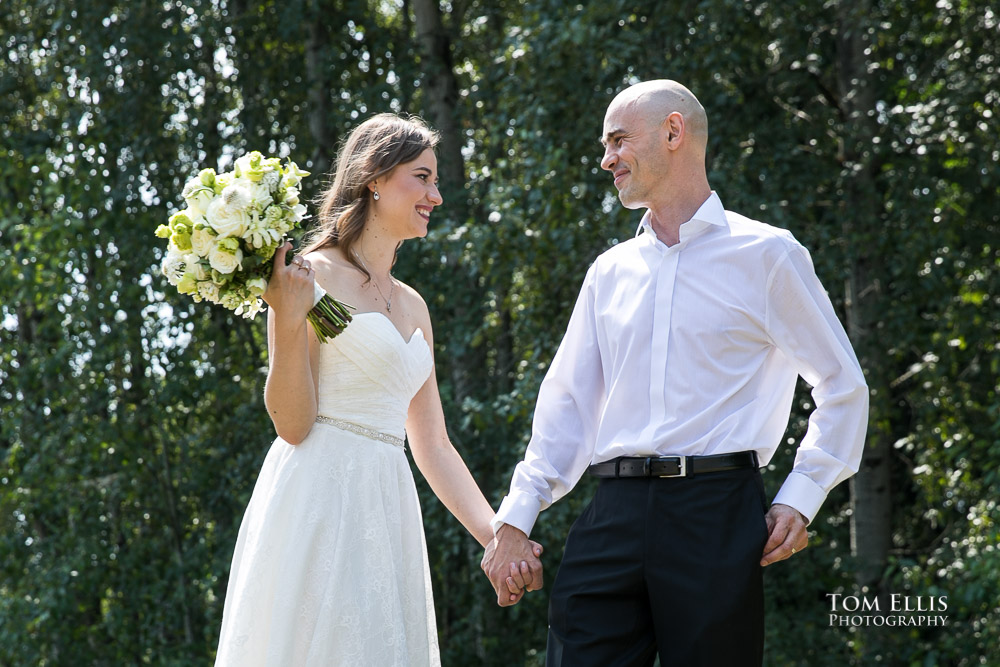 Newlywed couple outdoors on a beautiful summer day after their courthouse wedding