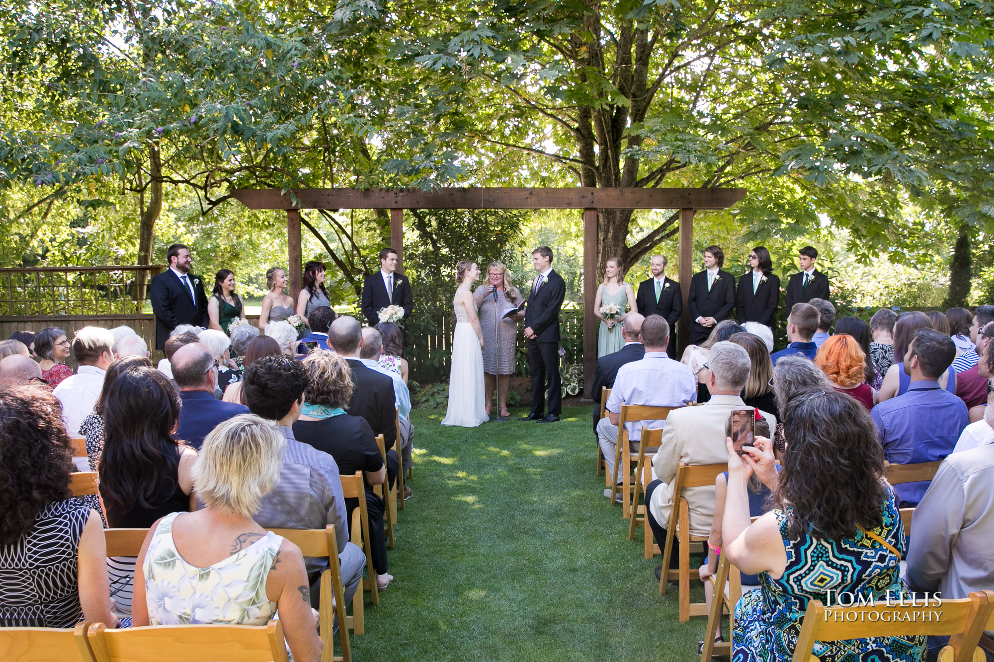 Outdoor Seattle wedding ceremony at the Hall at Fauntleroy by Tom Ellis Photography