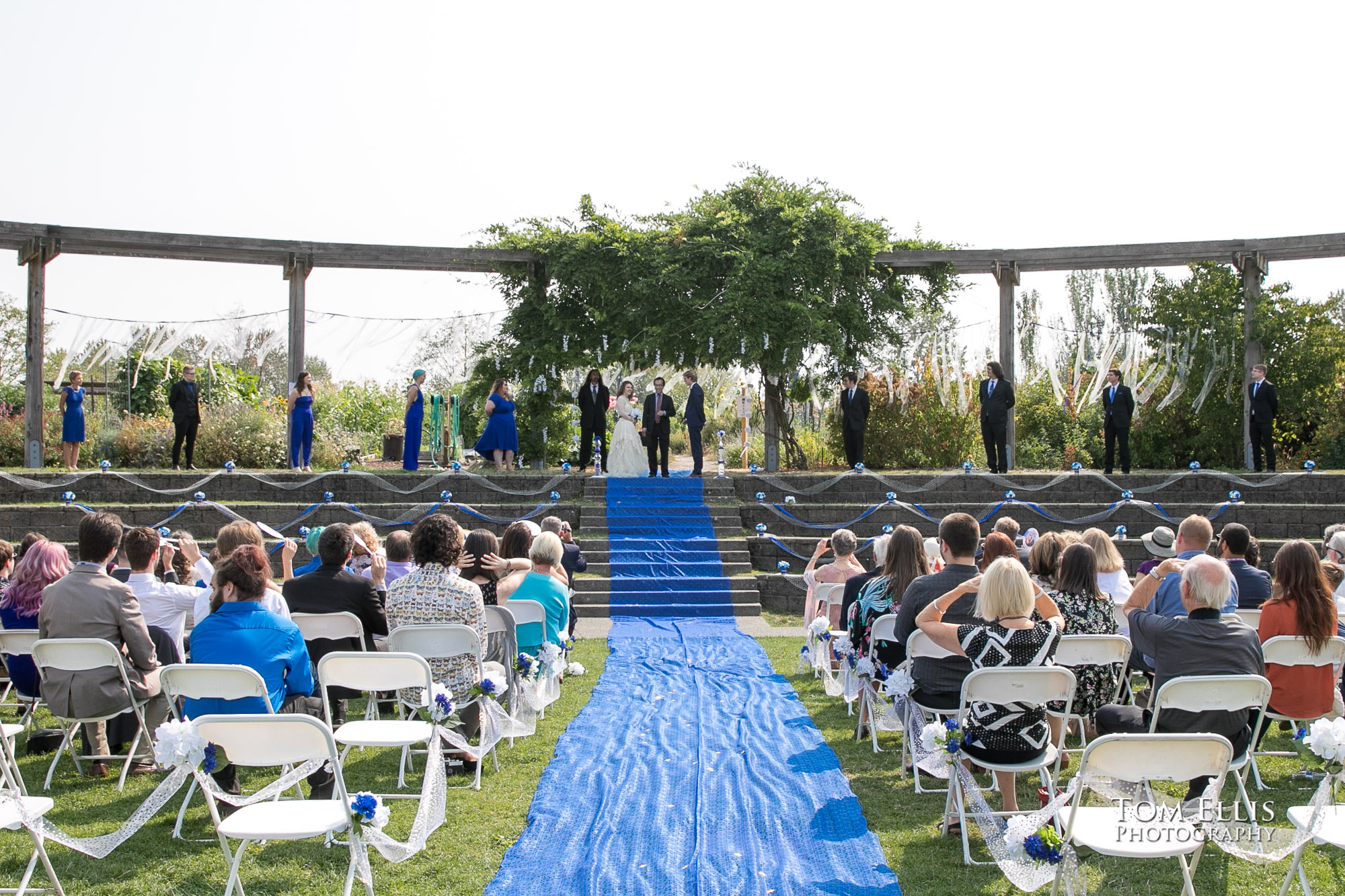 Outdoor wedding ceremony of Amber and Peter at the Amphitheater at Magnuson Park in Seattle