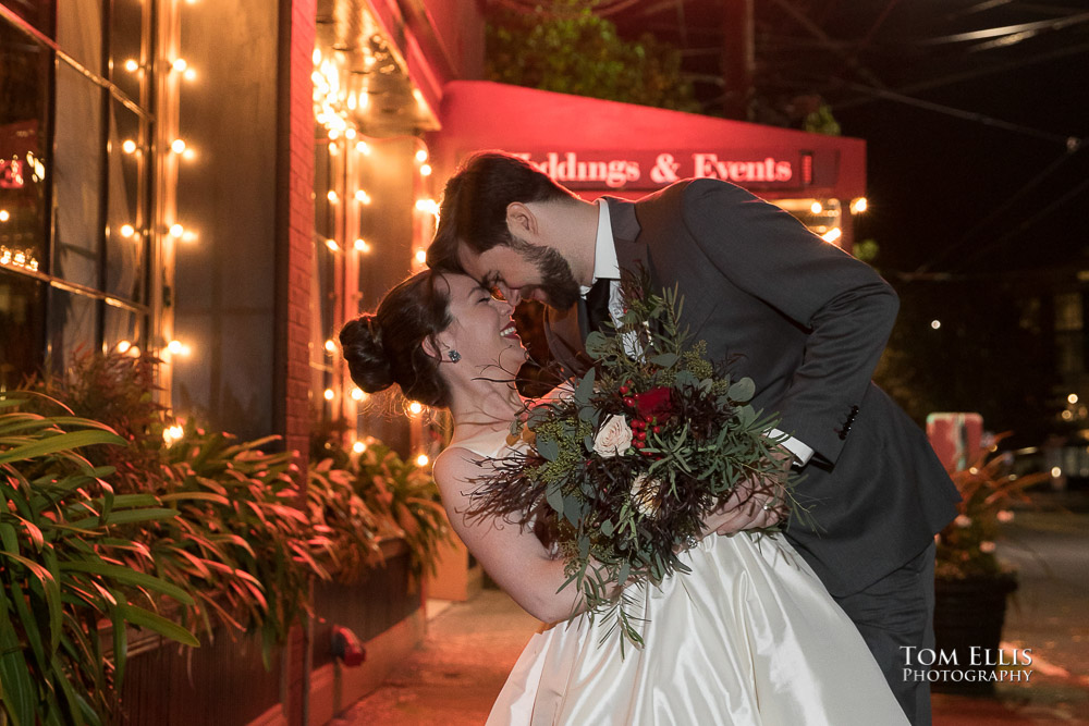 Bride Amanda and groom Joe have a moment outside the Lake Union Cafe during their wedding reception. Tom Ellis Photography, Seattle wedding photographer