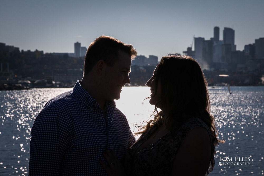 Silouette photo of couple with Seattle background during their engagement photo session at Gas Works Park