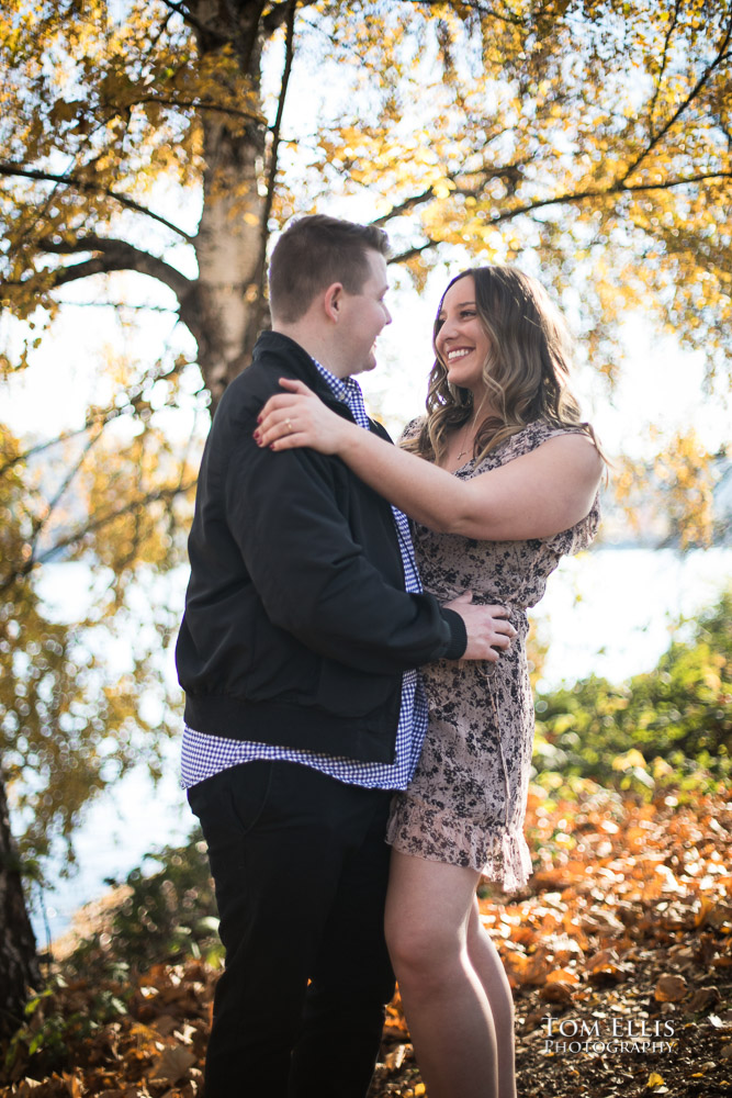 Kate and Kevin under the birch trees during their engagement photo session at Gas Works Park