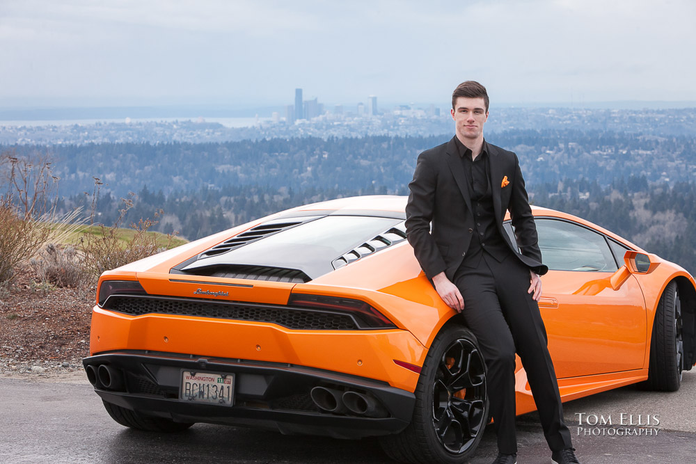 Luke all in black with an orange tie with his orange Lamborghini during his senior photo session at Newcastle Golf Club. Tom Ellis Photography, Seattle senior photographer