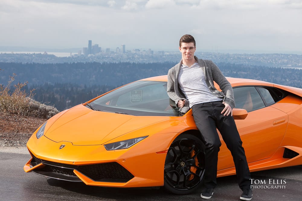 Luke leaning on his orange Lamborghini during his senior photo session at Newcastle Golf Club. Tom Ellis Photography, Seattle senior photographer