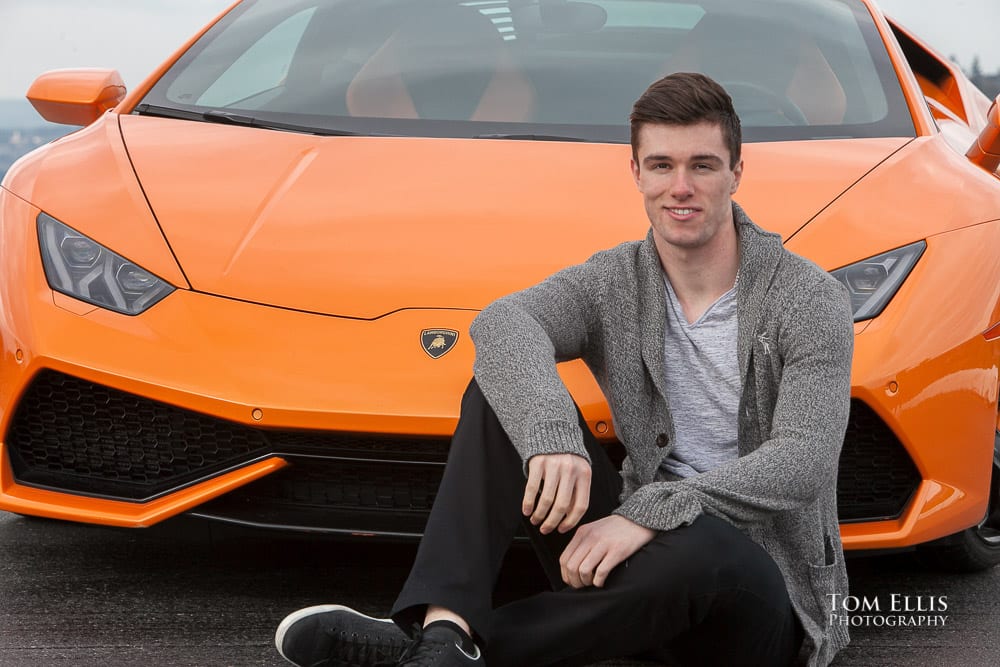 Close up of Luke sitting in front of his orange Lamborghini during his senior photo session at Newcastle Golf Club. Tom Ellis Photography, Seattle senior photographer