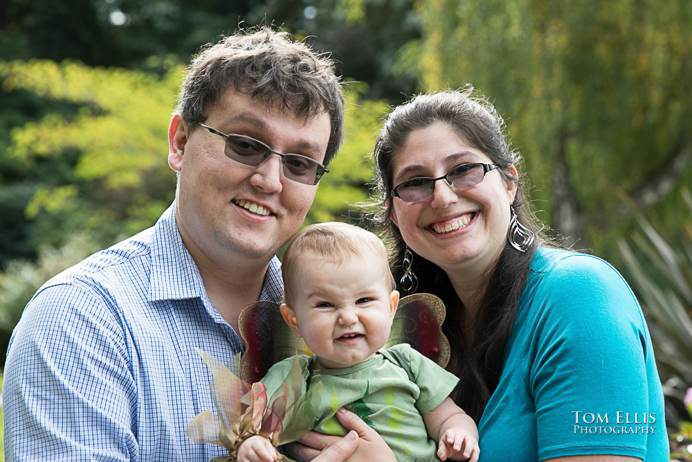 Mom May, dad Joel and baby Zoe pose for a photo during their family portrait session with Tom Ellis Photography, top Seattle area family photographer