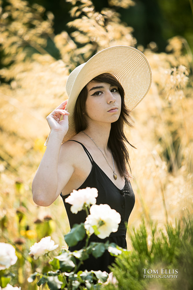 Beautiful high school senior girl in the flowers during her senior photo session at Bellevue Botanical Gardens