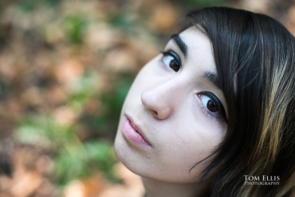 Close up head shot of Beautiful high school senior girl during her senior photo session at Bellevue Botanical Gardens