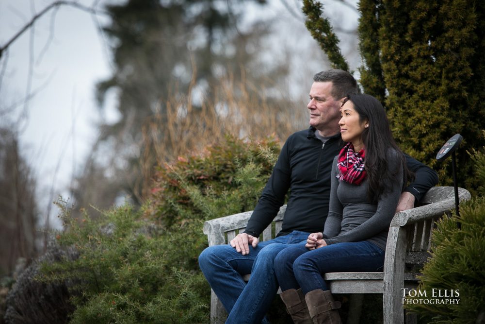 Elaina and Trip sit and enjoy the park during our Seattle area engagement photo session at the Bellevue Botanical Garden