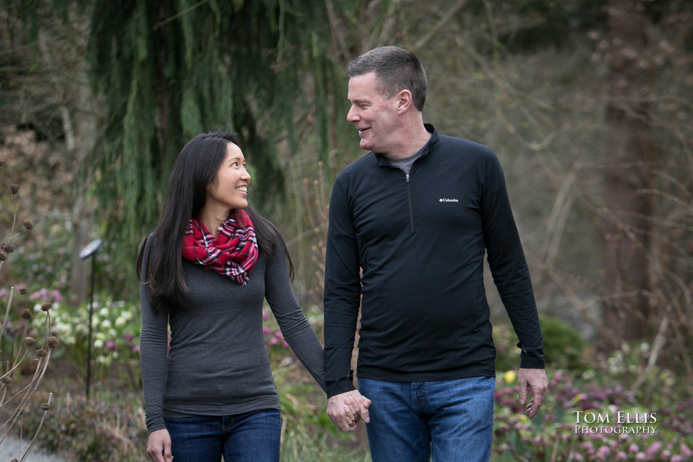Elaina and Trip enjoy a romantic walk during our Seattle area engagement photo session at the Bellevue Botanical Garden