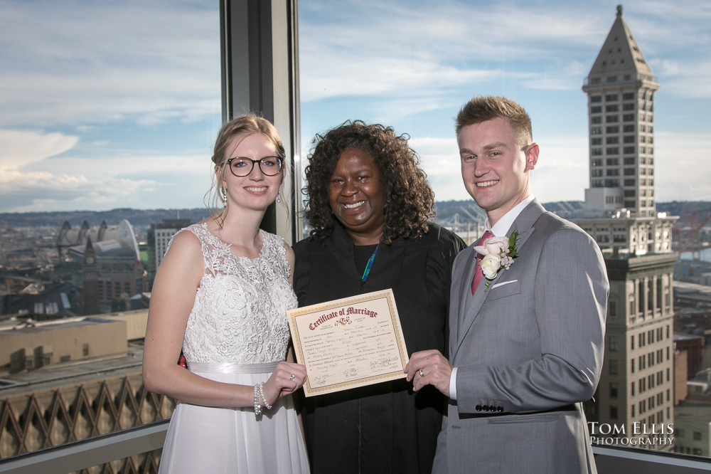 Seattle elopement wedding ceremony on the rooftop of the Seattle courthouse. Tom Ellis Photography, top-rated Seattle courthouse wedding photographer