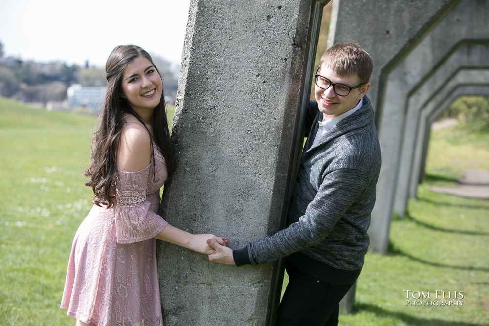Yoshimi and Jake hold hands during their engagement photo session at Gas Works Park