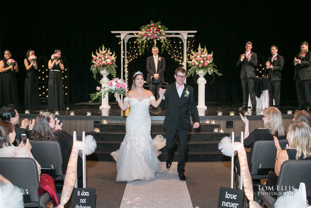 Bride Yoshimi and groom Jake recessing down the aisle at the conclusion of their wedding ceremony. Tom Ellis Photography, Seattle wedding photographer